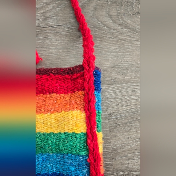 Woven rainbow satchel with a red strap and trim. - Picture 2 of 8